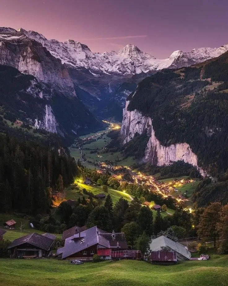 Lauterbrunnen valley Switzerland — Staubbach Falls cascading 297 metres down sheer limestone cliffs with the Jungfrau massif at the valley head